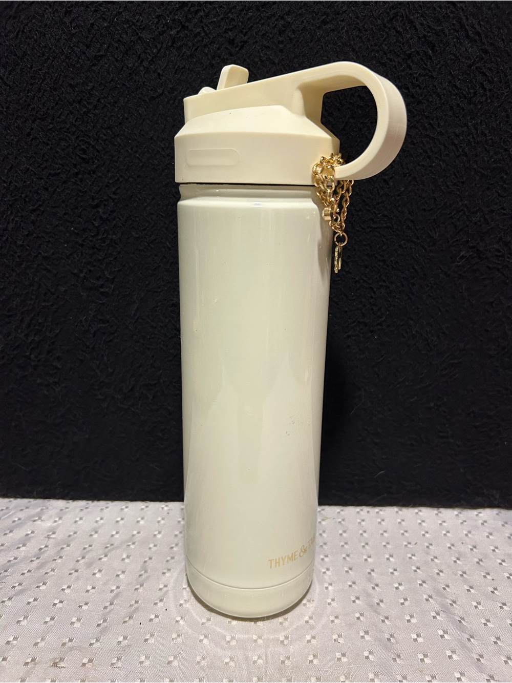 Thyme & Table 26 oz Water Bottle w/ Straw Lid decorated with gold-tone bow charm
